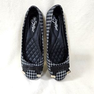 Flat black and white shoes
